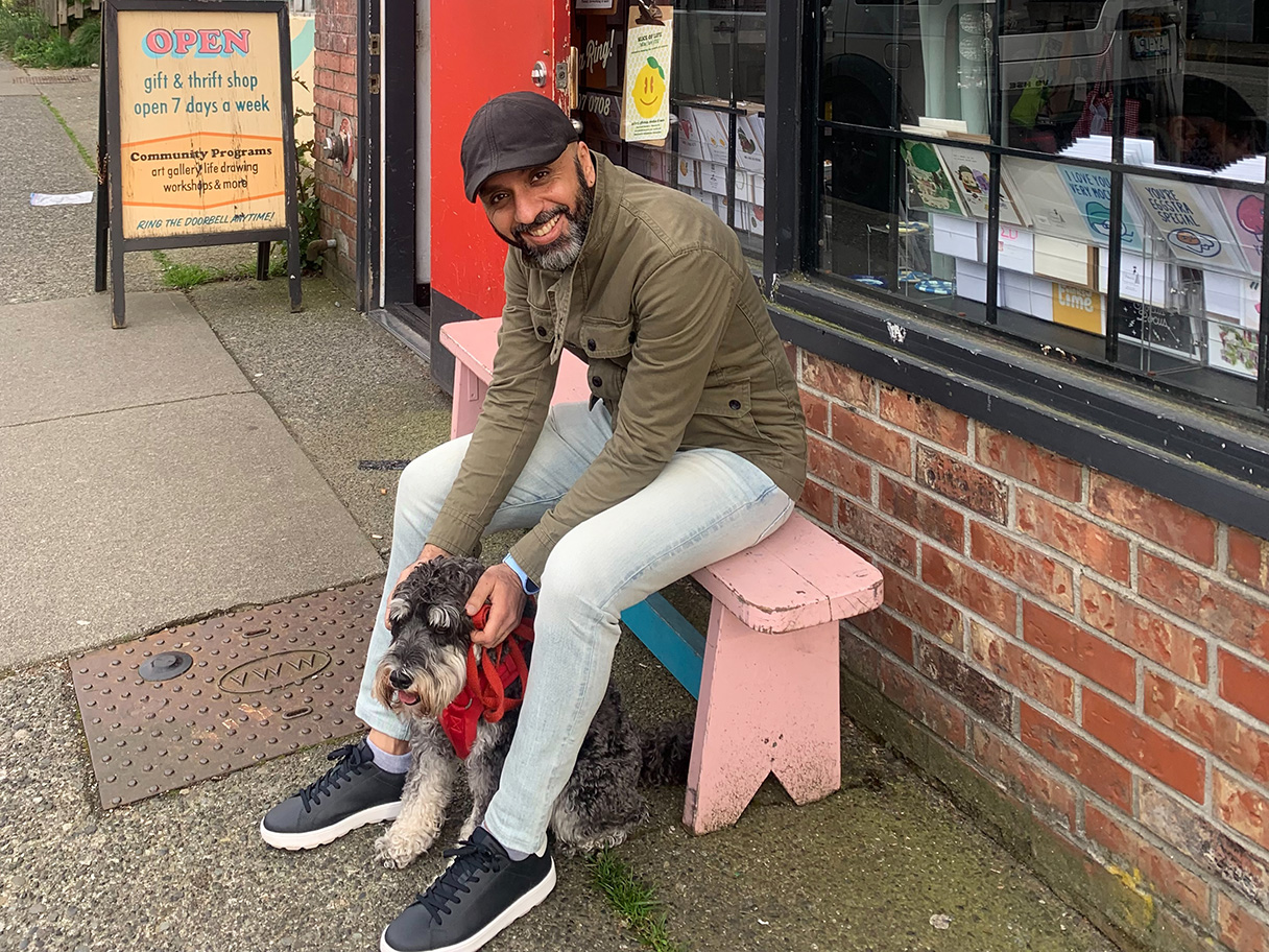 Vancouver artist Ally with his dog Alfie sitting outdoors